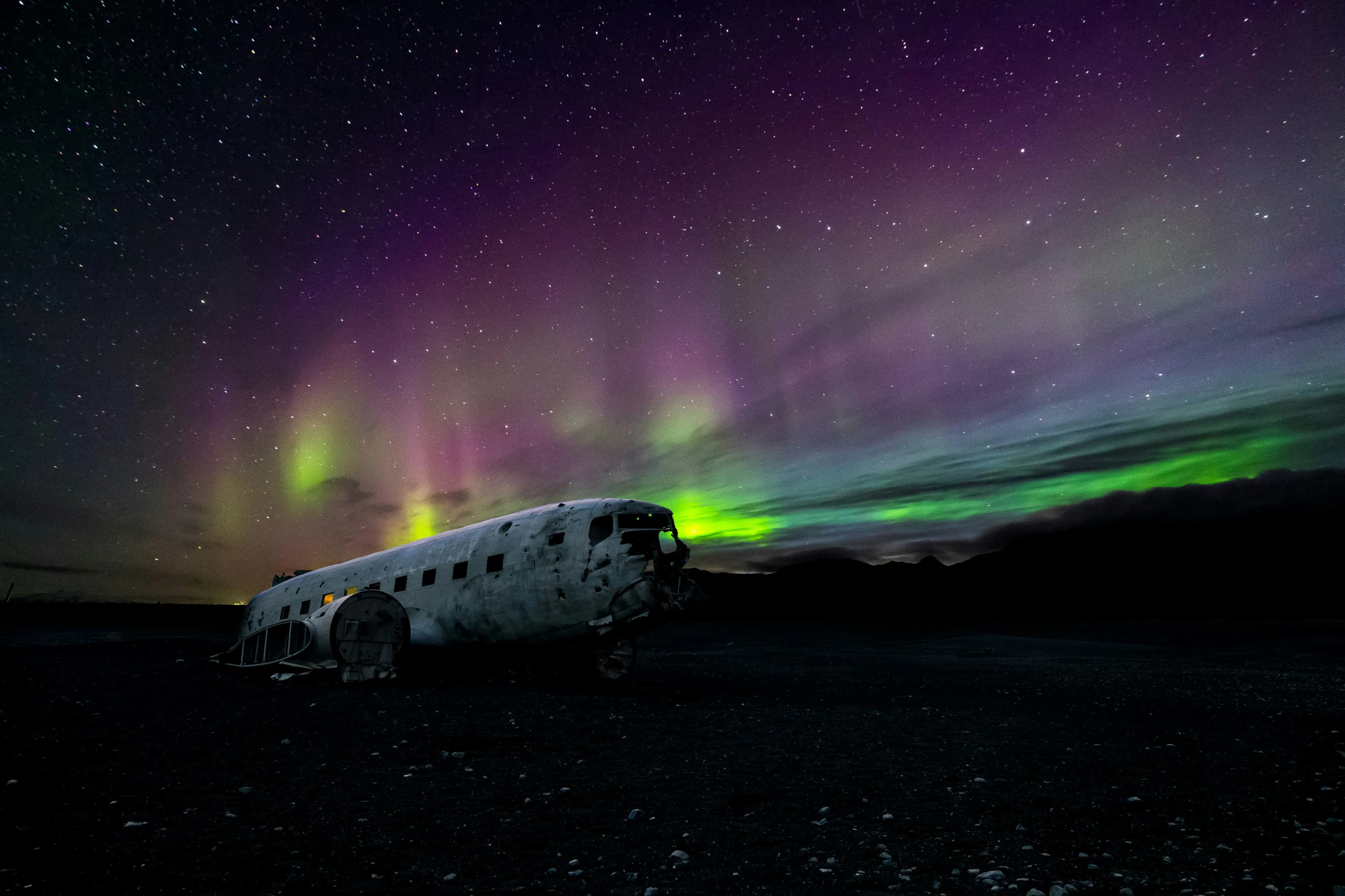 Northern lights reflected in Lake Torneträsk at Abisko